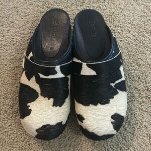 Sanita open back cow print clogs